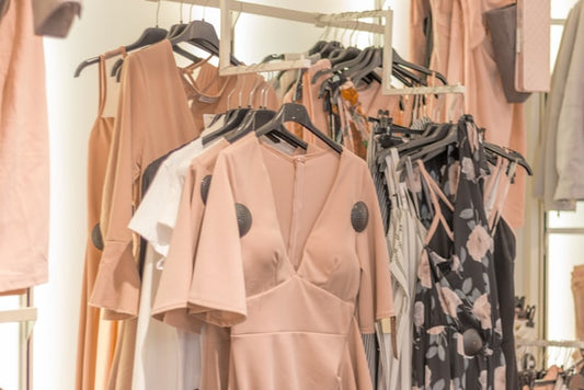 Photo by Alexander Kovacs on Unsplash This photo shows dresses in a boutique. 